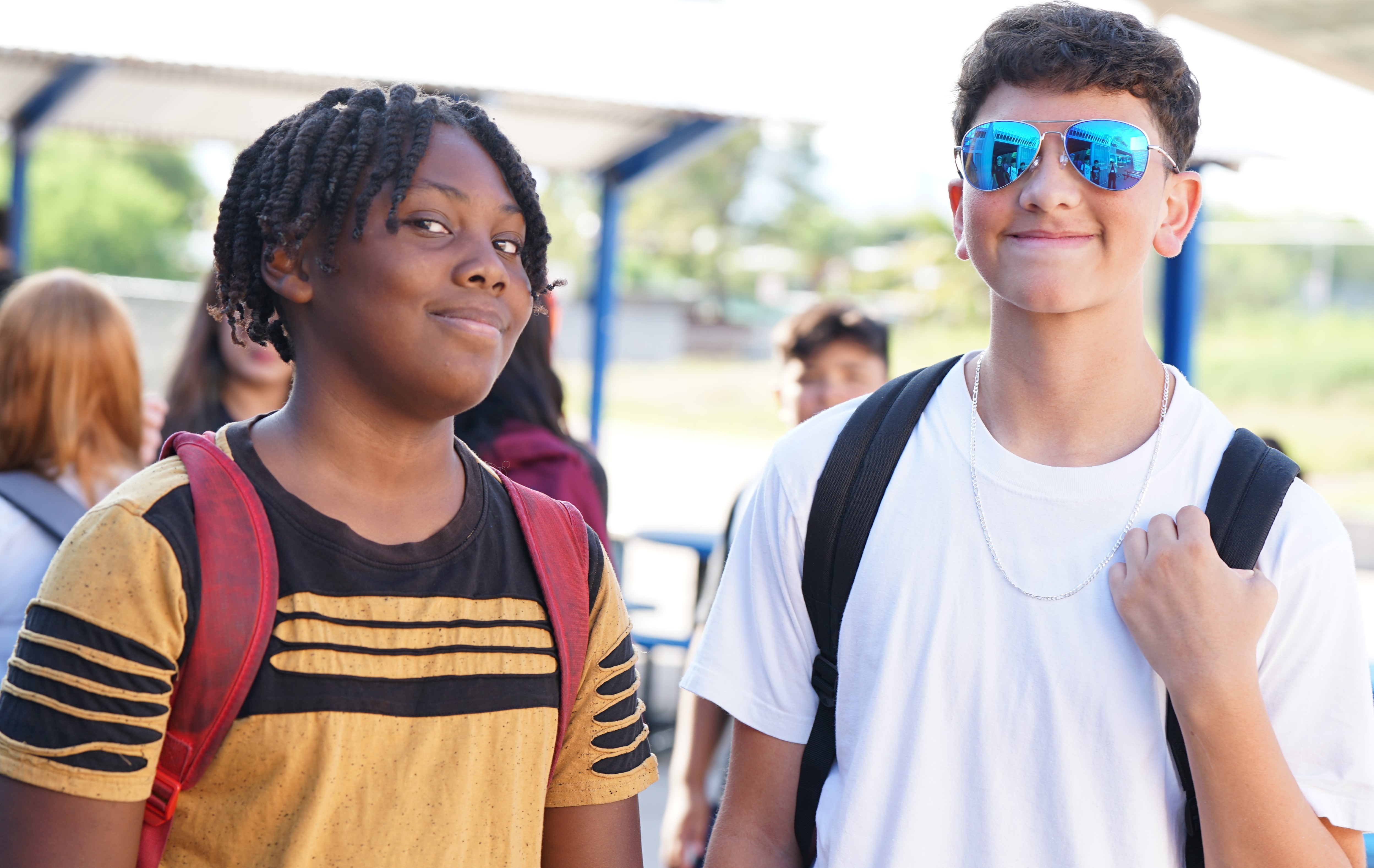 Two boys smile outside Magee on the first day of school